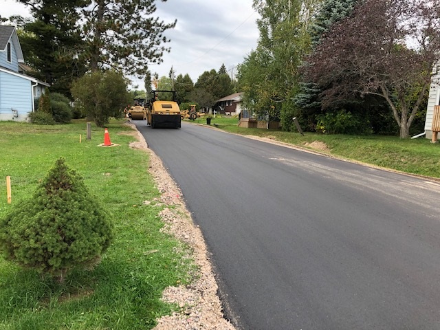 A picture showing a new road surface being constructed.