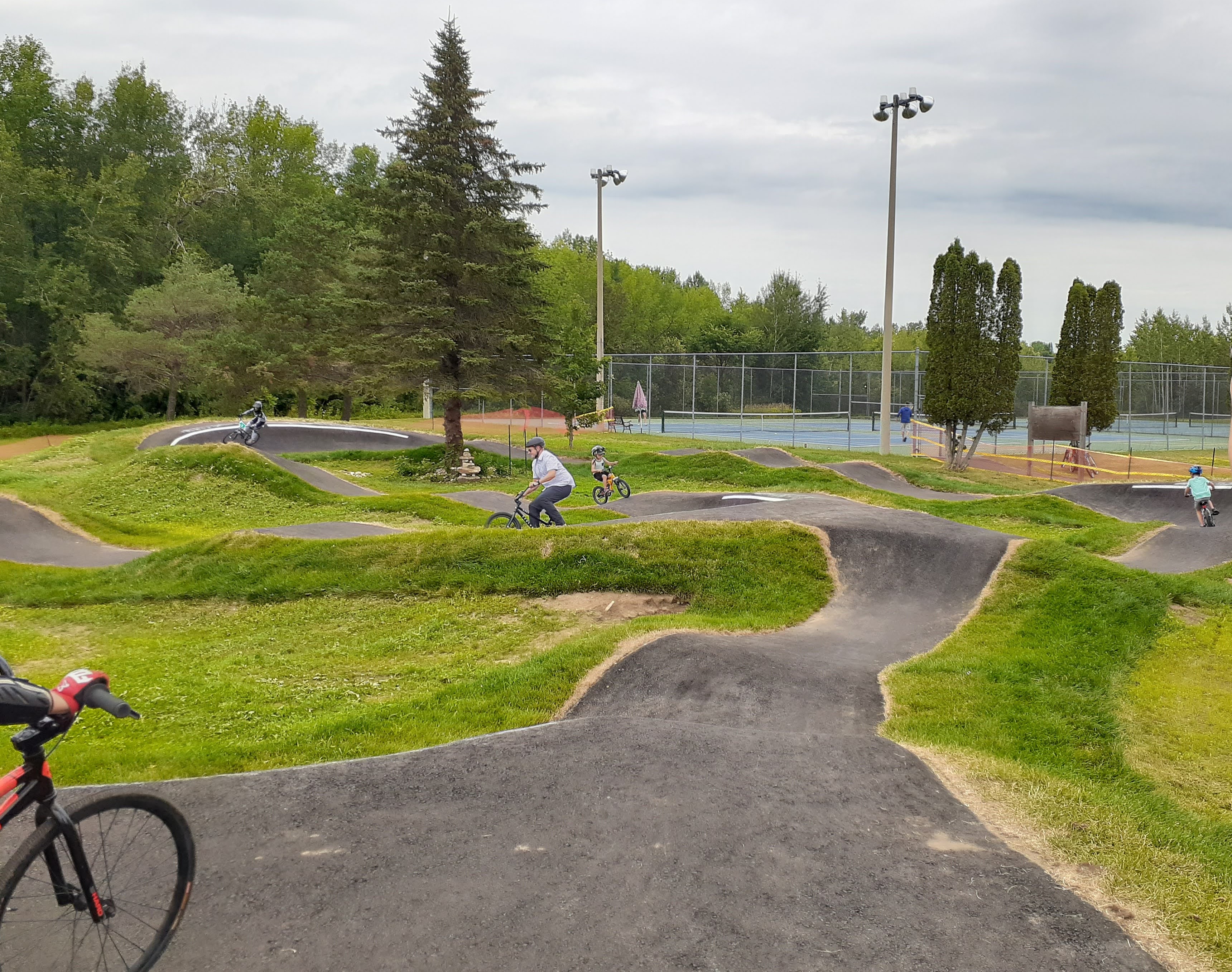A photograph of cyclists using the Perth Pump Track.