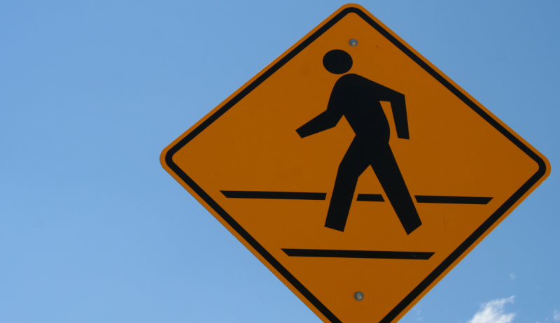 A stock image of a crosswalk sign. 